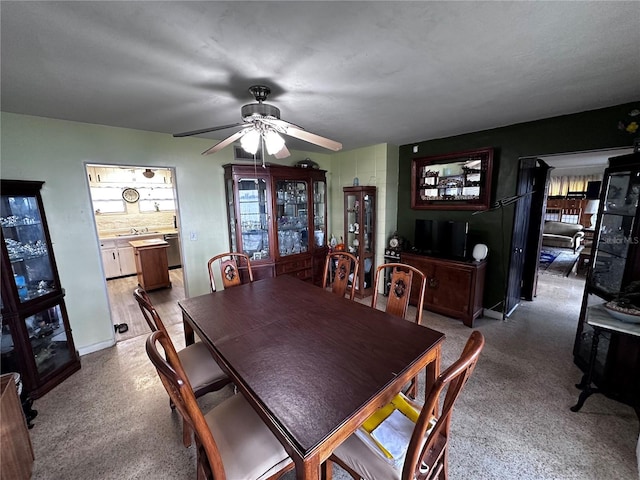 dining area featuring a ceiling fan