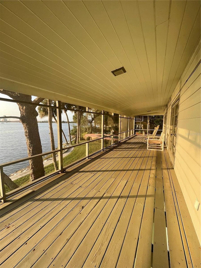 wooden deck featuring a water view