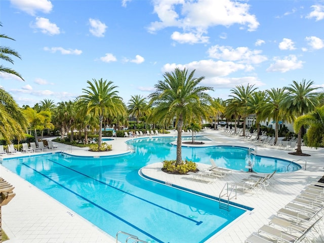 community pool with a patio area