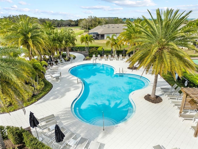 community pool with a patio area