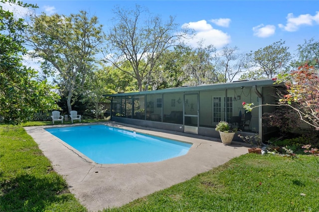 pool with a yard and a sunroom