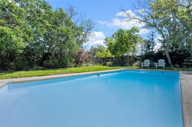 view of swimming pool featuring a fenced backyard and a fenced in pool