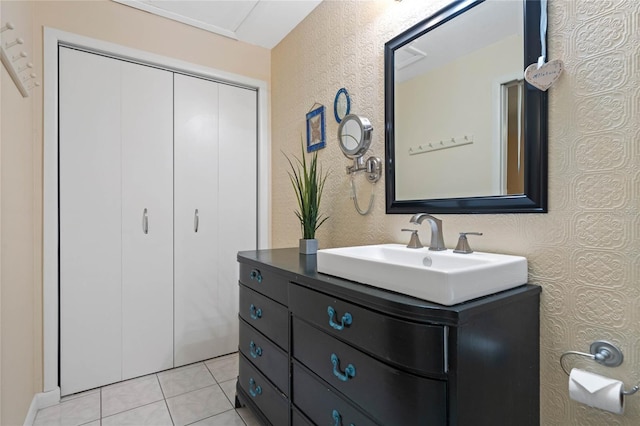 bathroom featuring tile patterned flooring and vanity