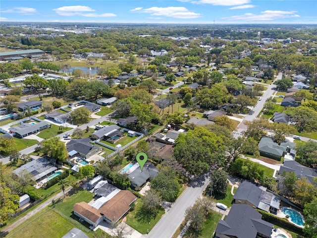 bird's eye view featuring a residential view and a water view