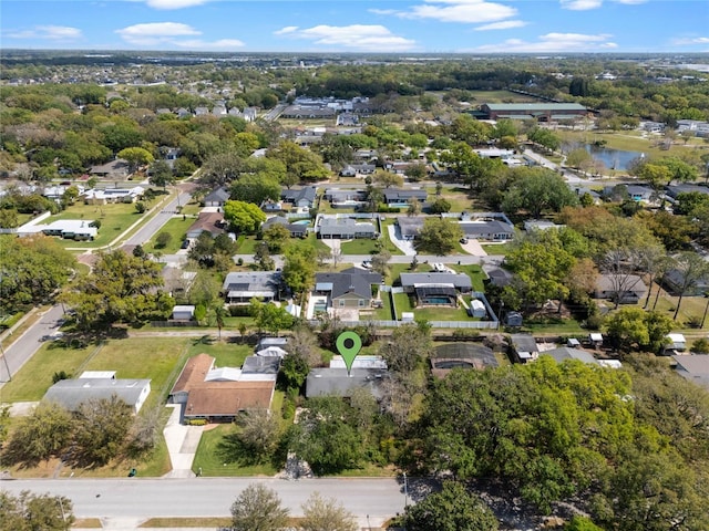 bird's eye view featuring a residential view and a water view