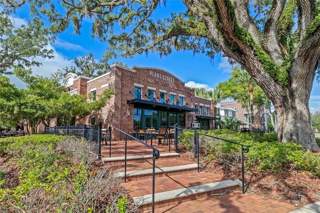 view of property with fence