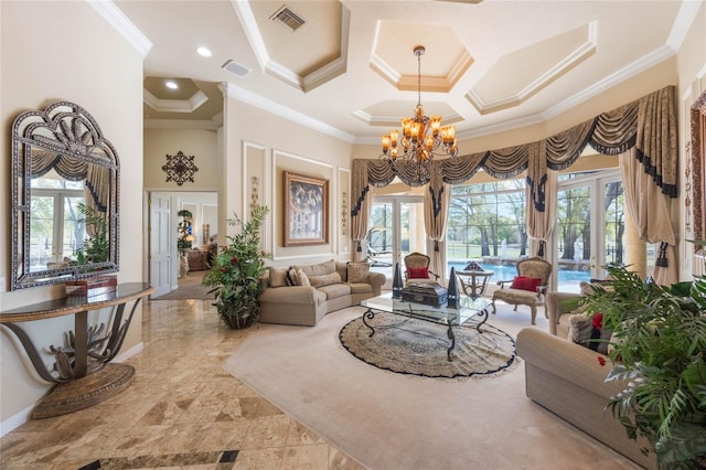 living room featuring visible vents, a high ceiling, ornamental molding, and a notable chandelier