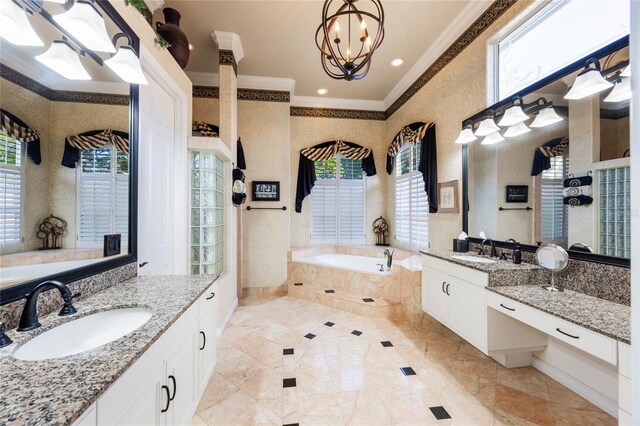 bathroom with two vanities, a garden tub, ornamental molding, and a sink