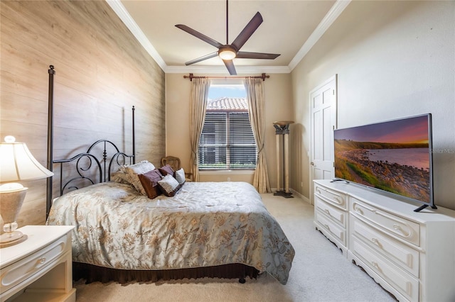 bedroom featuring light colored carpet, crown molding, and ceiling fan