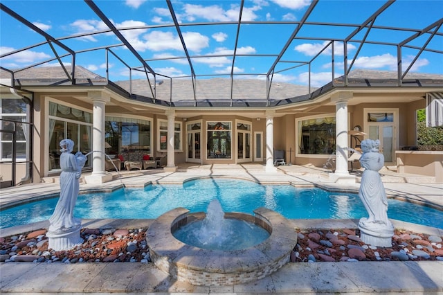 view of swimming pool with a lanai, a patio area, and a pool with connected hot tub