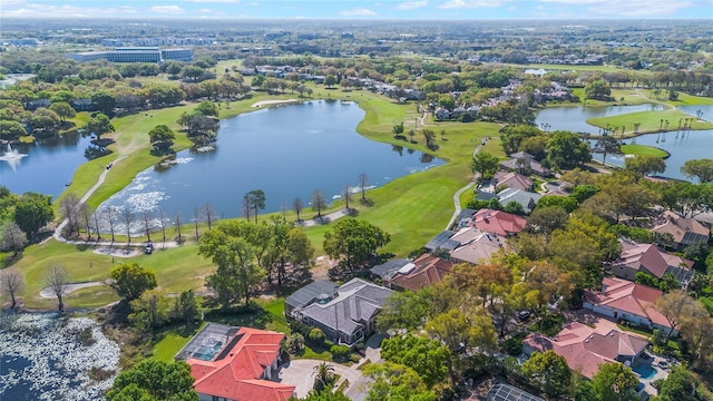 bird's eye view featuring view of golf course, a water view, and a residential view