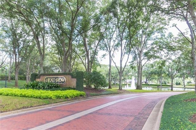 view of home's community featuring decorative driveway