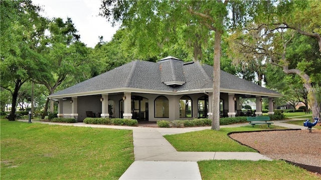 view of property's community with a yard