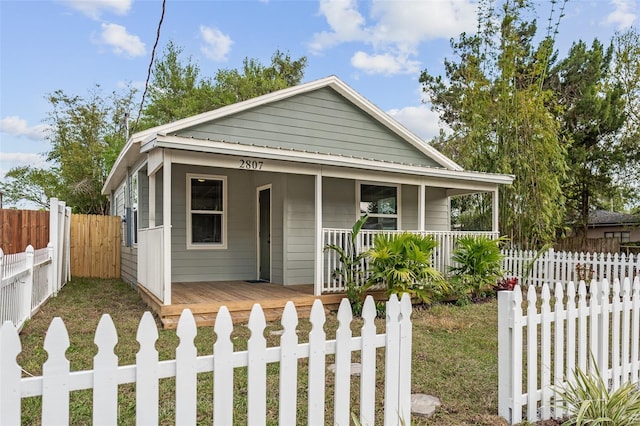 view of front facade with a fenced front yard and a porch