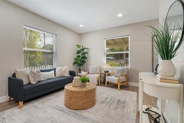 sitting room with recessed lighting, baseboards, and light wood-style floors