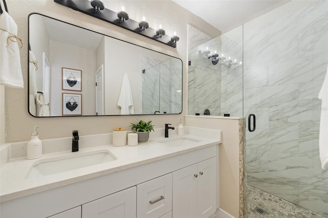 bathroom with a sink, double vanity, and a shower stall