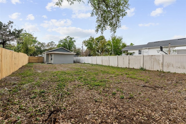 view of yard with a fenced backyard