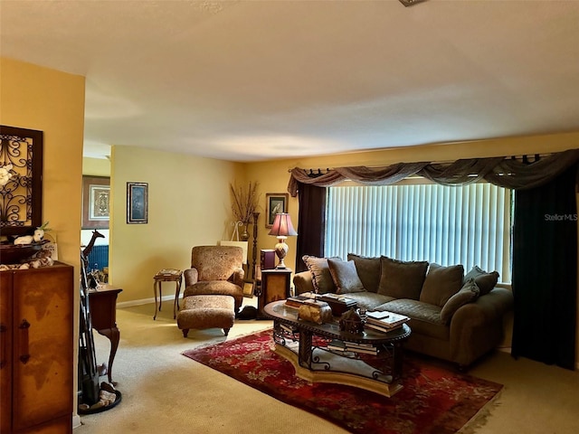 living room with baseboards and light carpet