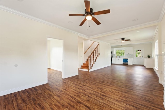 unfurnished living room with a ceiling fan, dark wood finished floors, stairs, and crown molding