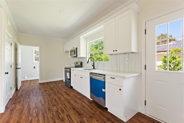 kitchen featuring a sink, stainless steel appliances, white cabinets, and dark wood-style flooring