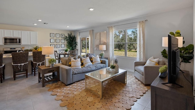 living area with light tile patterned floors and recessed lighting