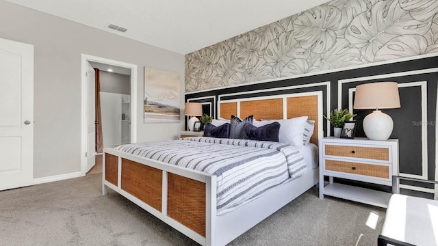 carpeted bedroom with wallpapered walls, baseboards, and visible vents