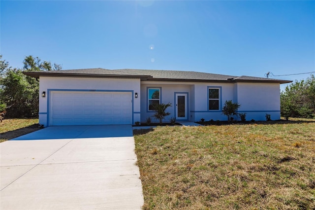 ranch-style house with concrete driveway, an attached garage, a front yard, and stucco siding