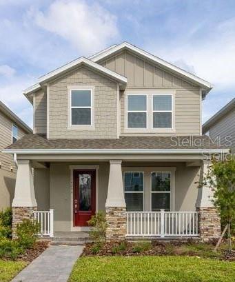 craftsman house featuring stone siding and a porch