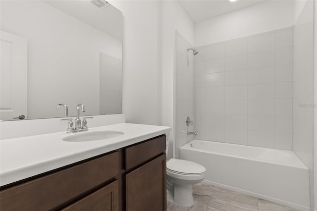 bathroom featuring visible vents, toilet, vanity, and shower / tub combination