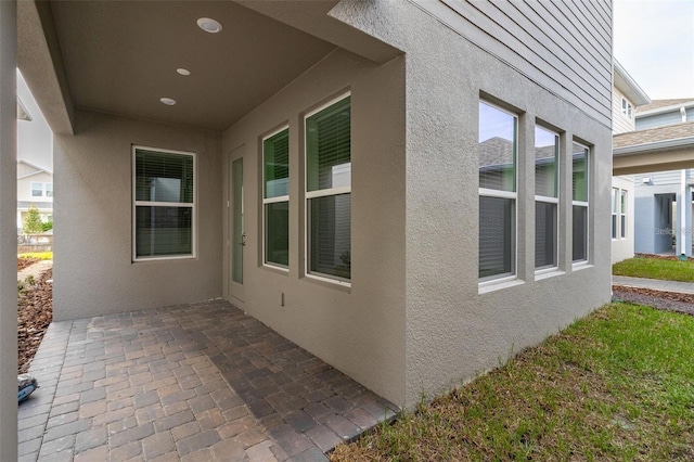 view of property exterior with a patio area and stucco siding