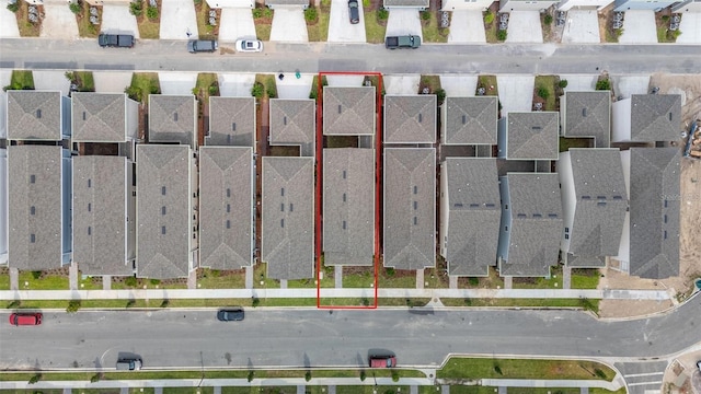 birds eye view of property with a residential view