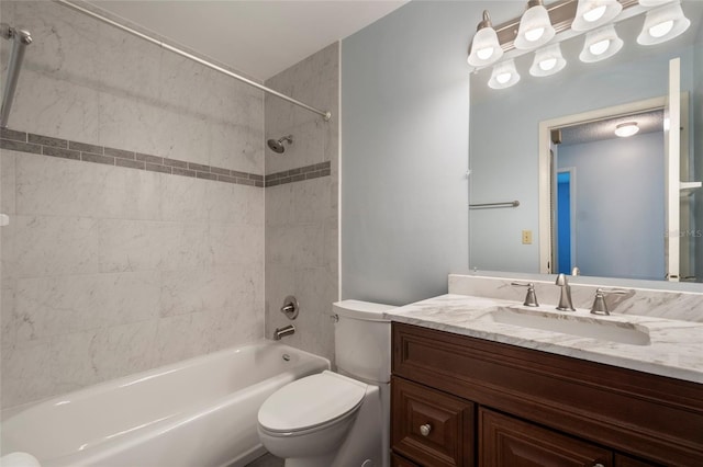 bathroom with vanity, toilet, and washtub / shower combination