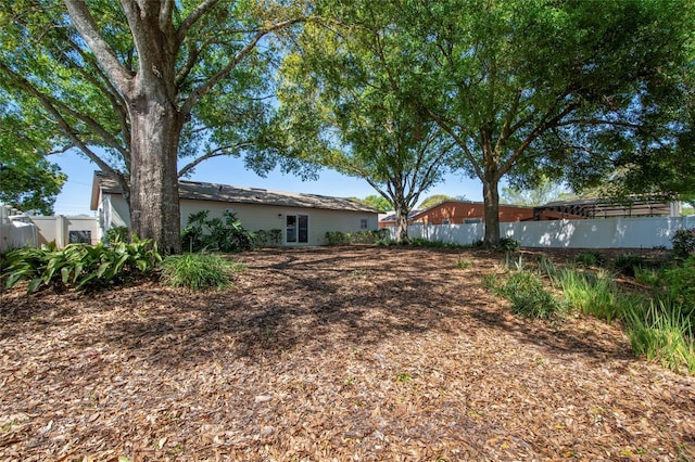 view of yard featuring fence