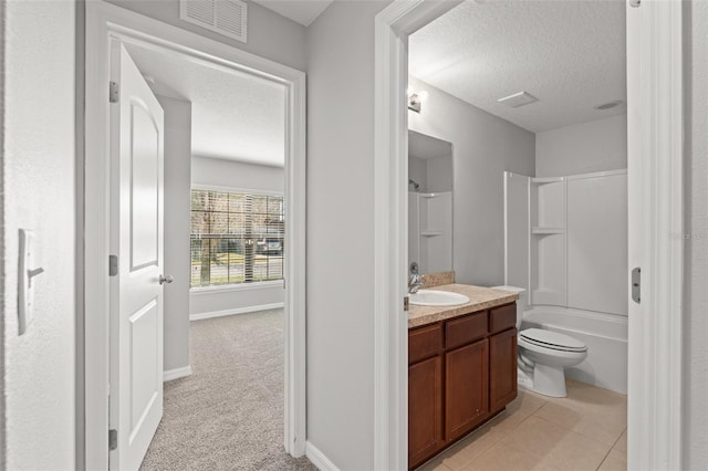 bathroom featuring visible vents, toilet, vanity, a textured ceiling, and  shower combination