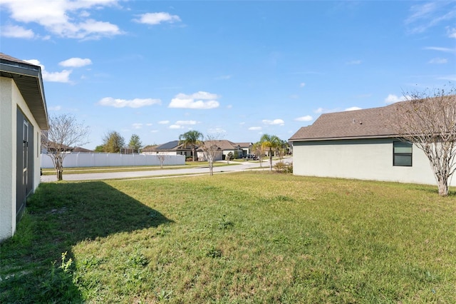 view of yard with fence