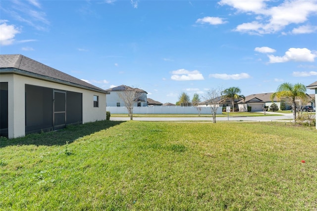 view of yard featuring a residential view