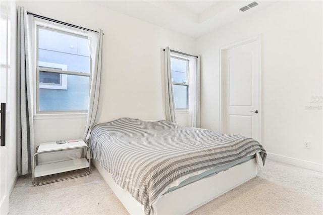 bedroom featuring visible vents, baseboards, and carpet floors