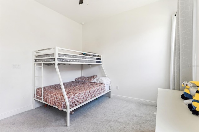 bedroom featuring baseboards, carpet, and ceiling fan