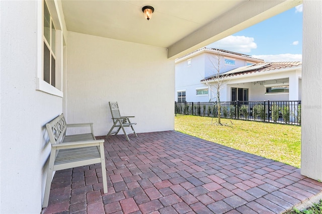 view of patio featuring fence