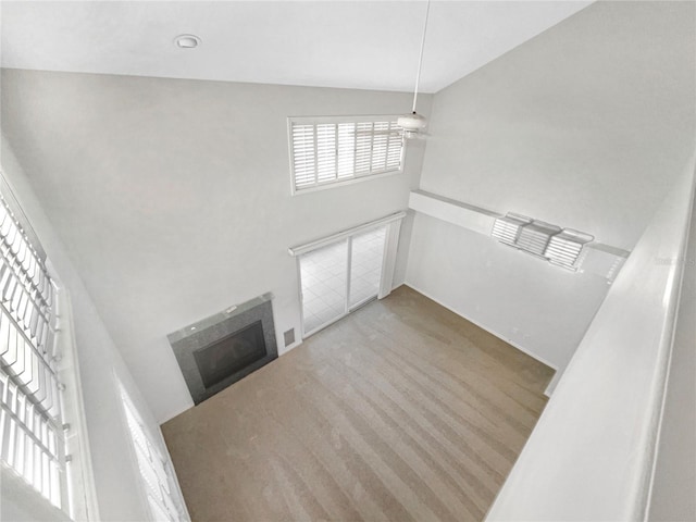 unfurnished living room featuring a fireplace