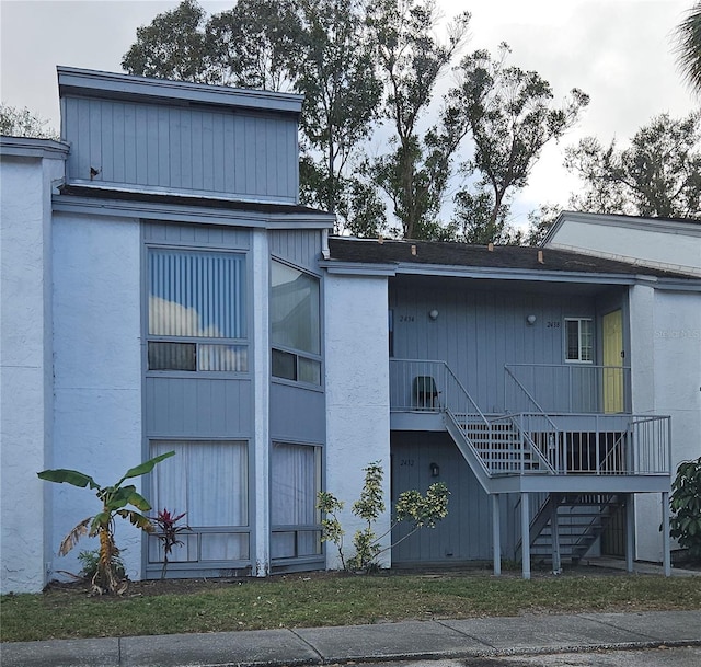 view of property featuring stairway