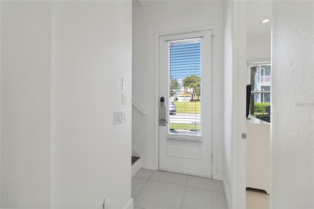 entryway with light tile patterned floors