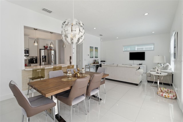 dining room featuring an inviting chandelier, light tile patterned floors, recessed lighting, and visible vents