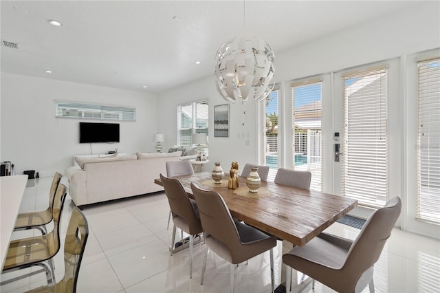 dining area featuring light tile patterned floors, a notable chandelier, recessed lighting, and visible vents