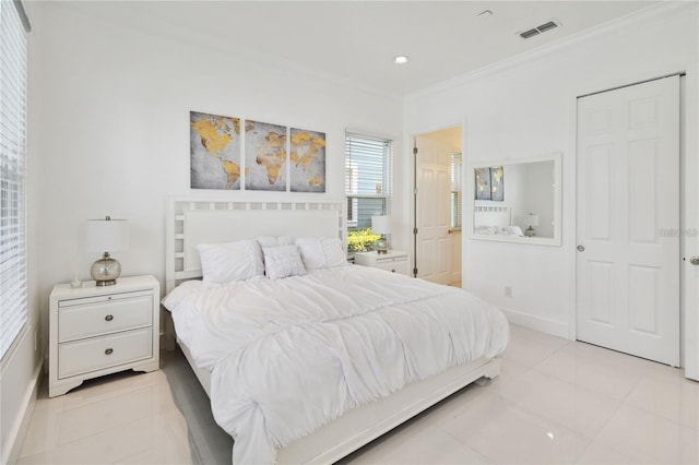 bedroom featuring light tile patterned flooring, baseboards, visible vents, and ornamental molding