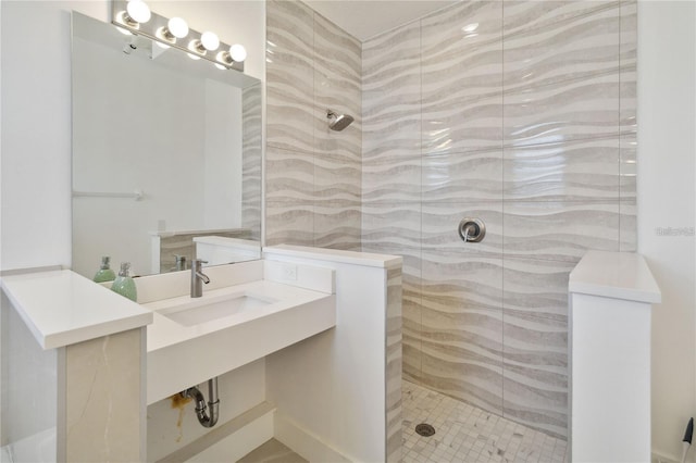 full bathroom featuring a walk in shower and a sink