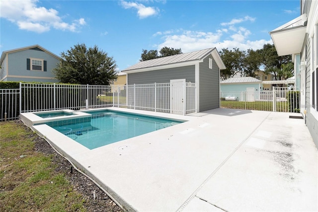 view of swimming pool featuring an outbuilding, a patio area, fence, and a pool with connected hot tub