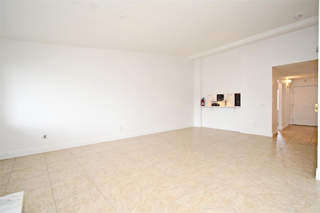 empty room with baseboards