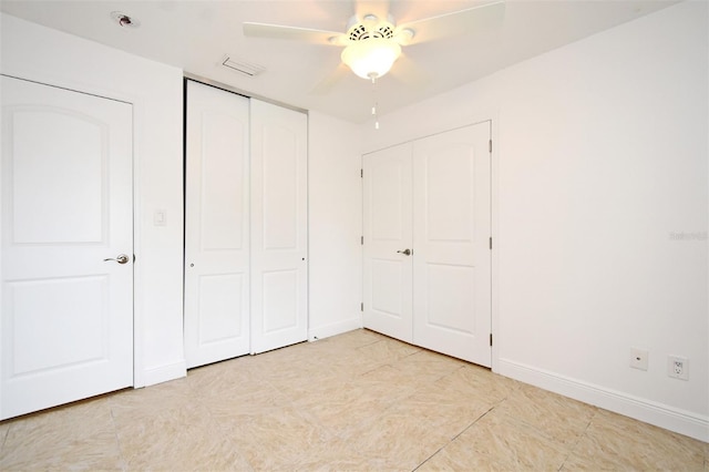 unfurnished bedroom with visible vents, ceiling fan, and baseboards