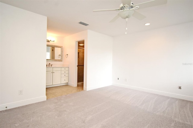 unfurnished bedroom featuring recessed lighting, visible vents, light colored carpet, and baseboards